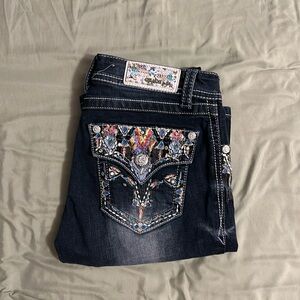 Grace in LA
Colorful, dark blue wash, boot cut jeans